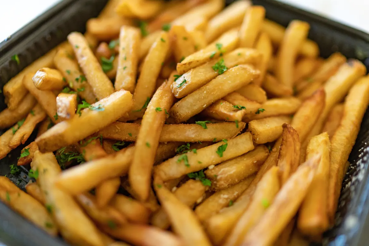 A tray of thin golden fries